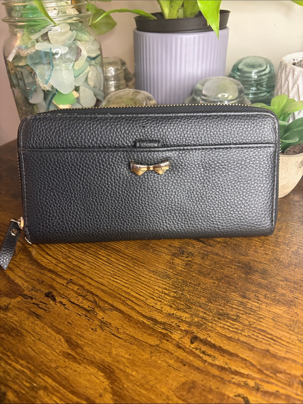 Anne Klein Black Pebbled Zip-Around Wallet with Gold Bow Accent